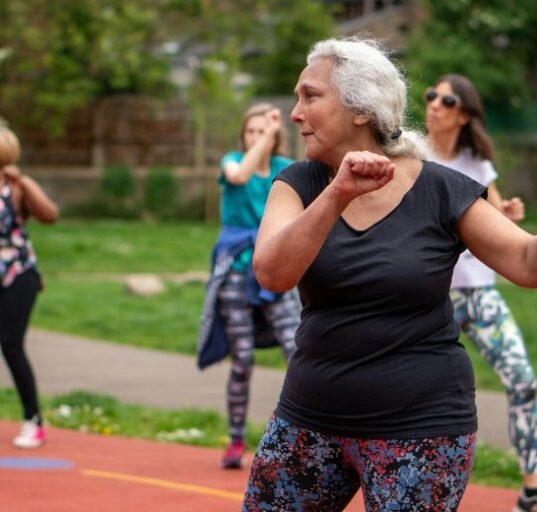 women exercising in a group for elderly