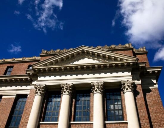 Harvard University has amended its lawsuit against the US administration by saying that its researchers would lose another $450 million in grants from several agencies.