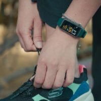 Person walking outdoors wearing fitness tracker while on GLP-1 weight loss medication